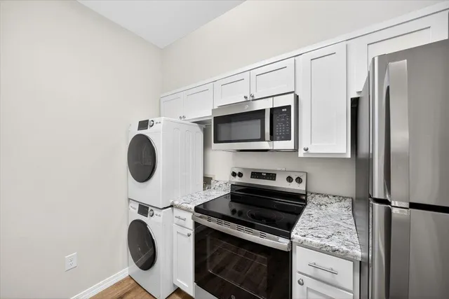 a kitchen with a stove and a microwave