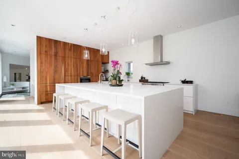 a kitchen with a sink and a refrigerator