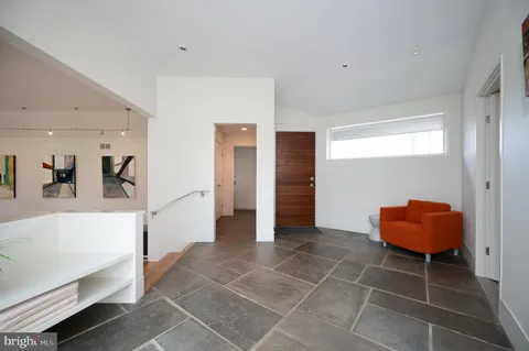 a view of livingroom with furniture and floor to ceiling window