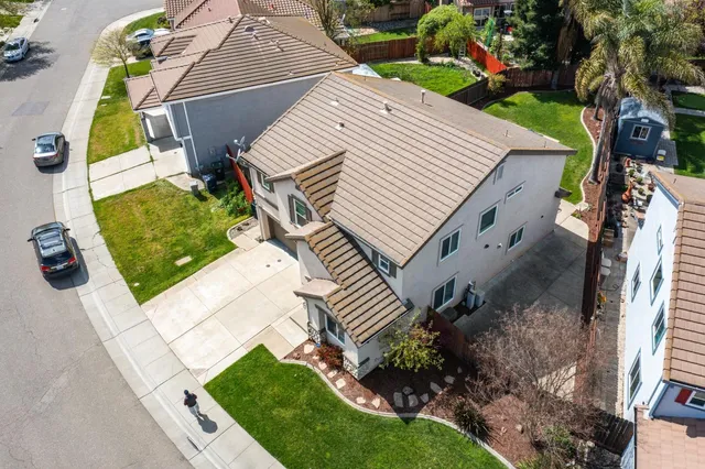 a aerial view of a house with a yard