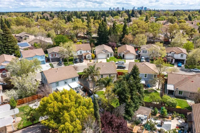 an aerial view of residential houses with outdoor space