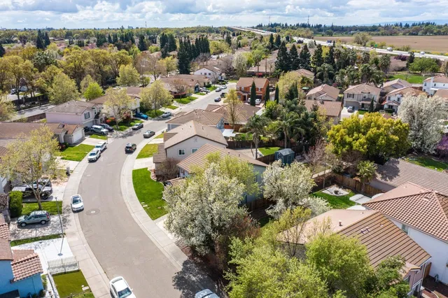 an aerial view of a house with a lake view