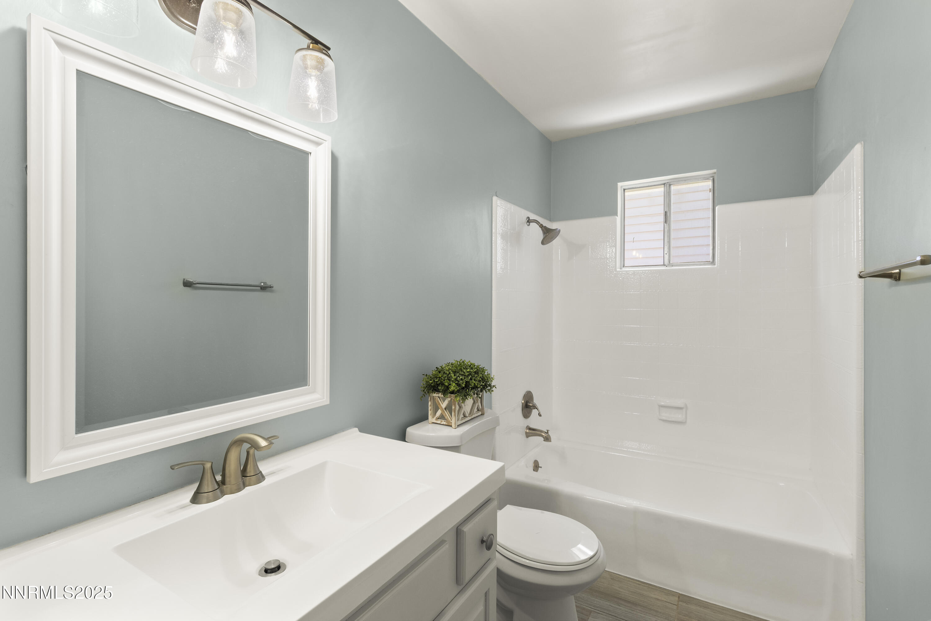 1430 Foster Drive Reno, NV 89509 - Photo 13 of 25 a bathroom with a sink a toilet and shower