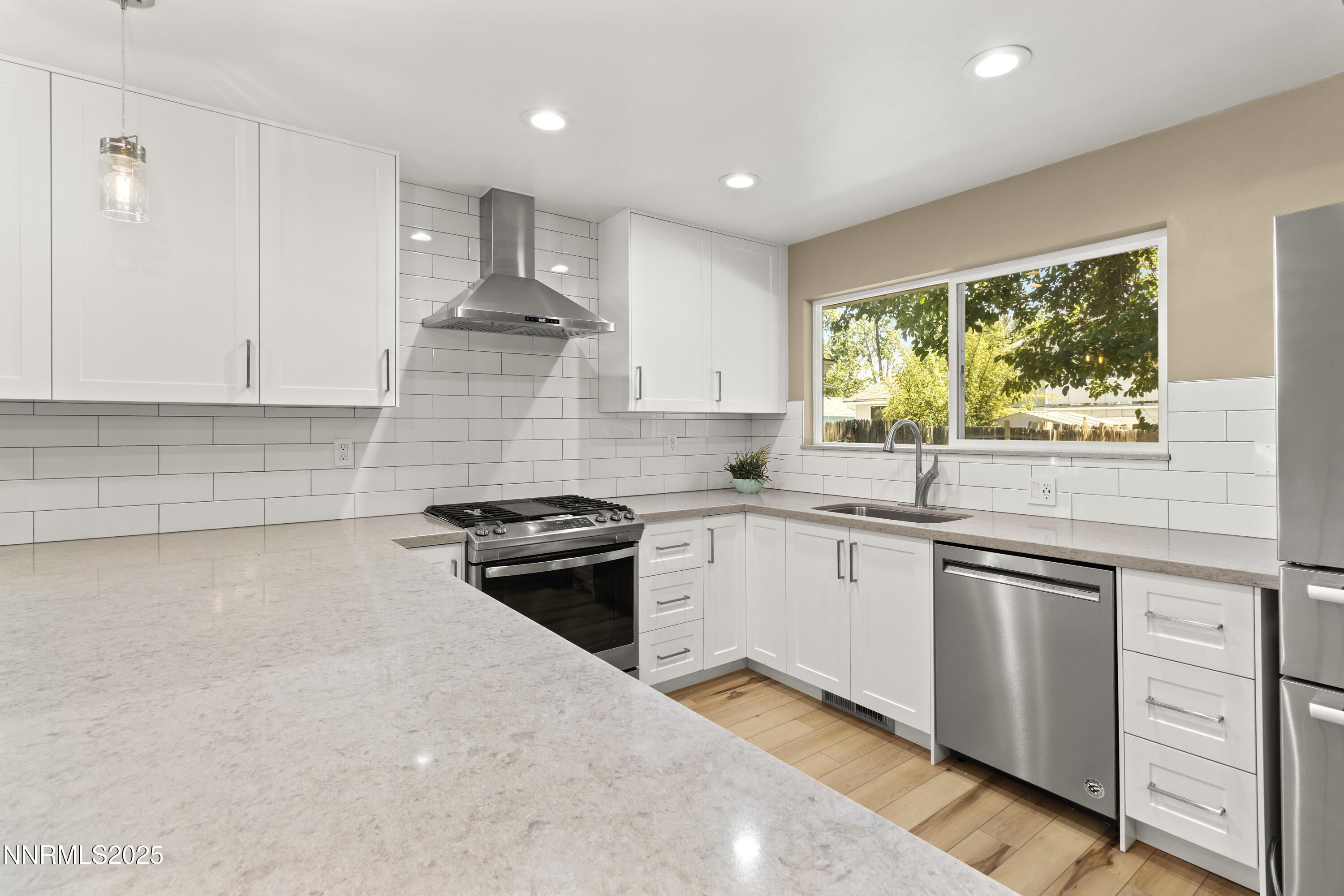 1430 Foster Drive Reno, NV 89509 - Photo 4 of 25 a kitchen with stainless steel appliances granite countertop a stove and a sink