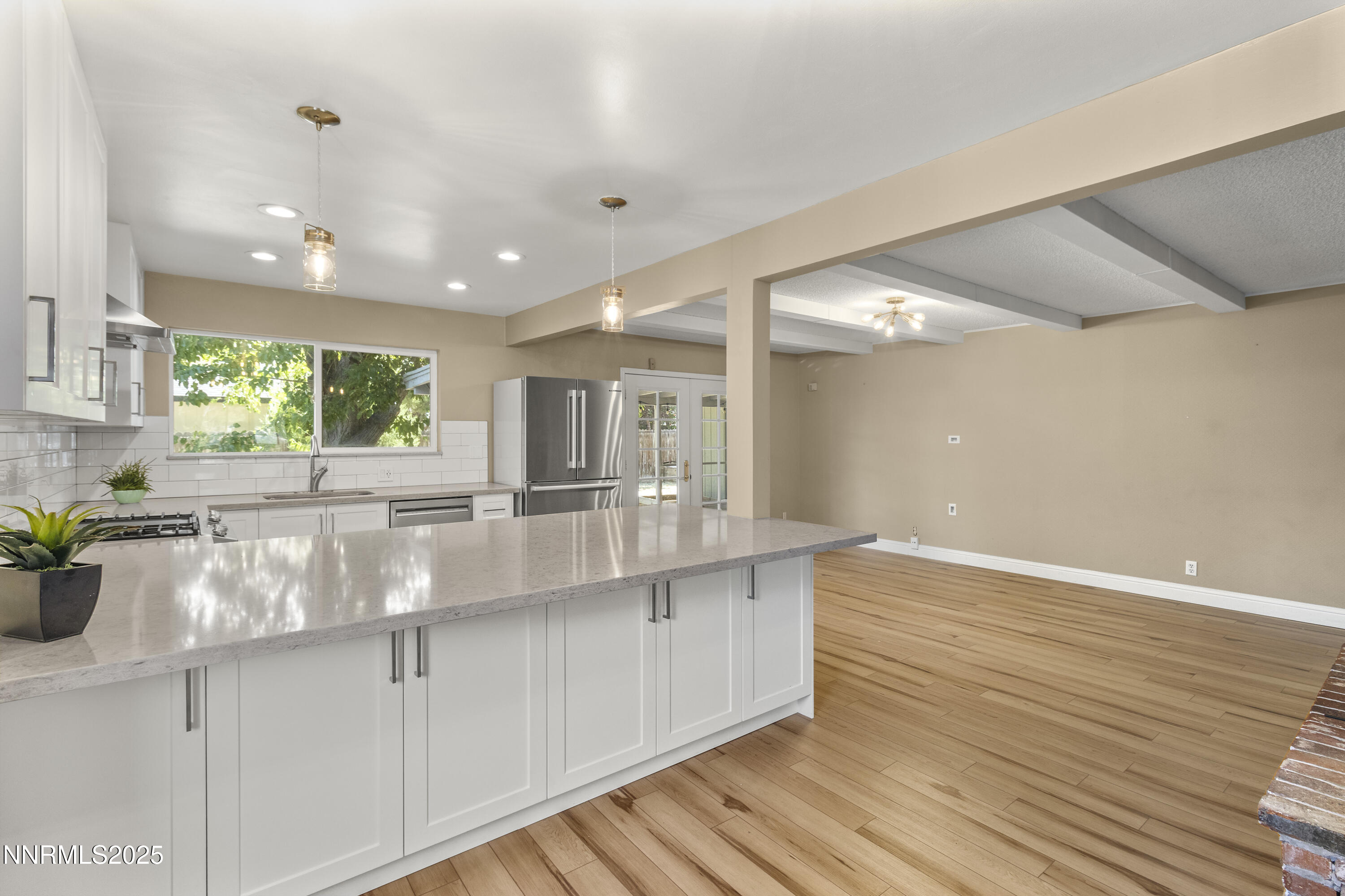 1430 Foster Drive Reno, NV 89509 - Photo 6 of 25 a kitchen with stainless steel appliances granite countertop a sink a counter space and cabinets