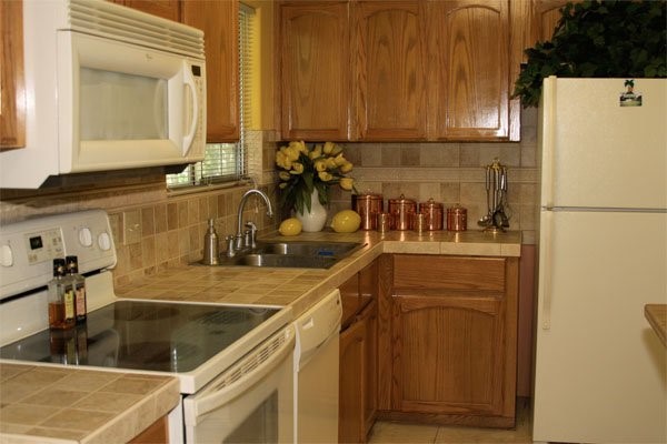 601 South 17th Street Harlingen, TX 78550 - Photo 5 of 11 a kitchen with a sink and a refrigerator