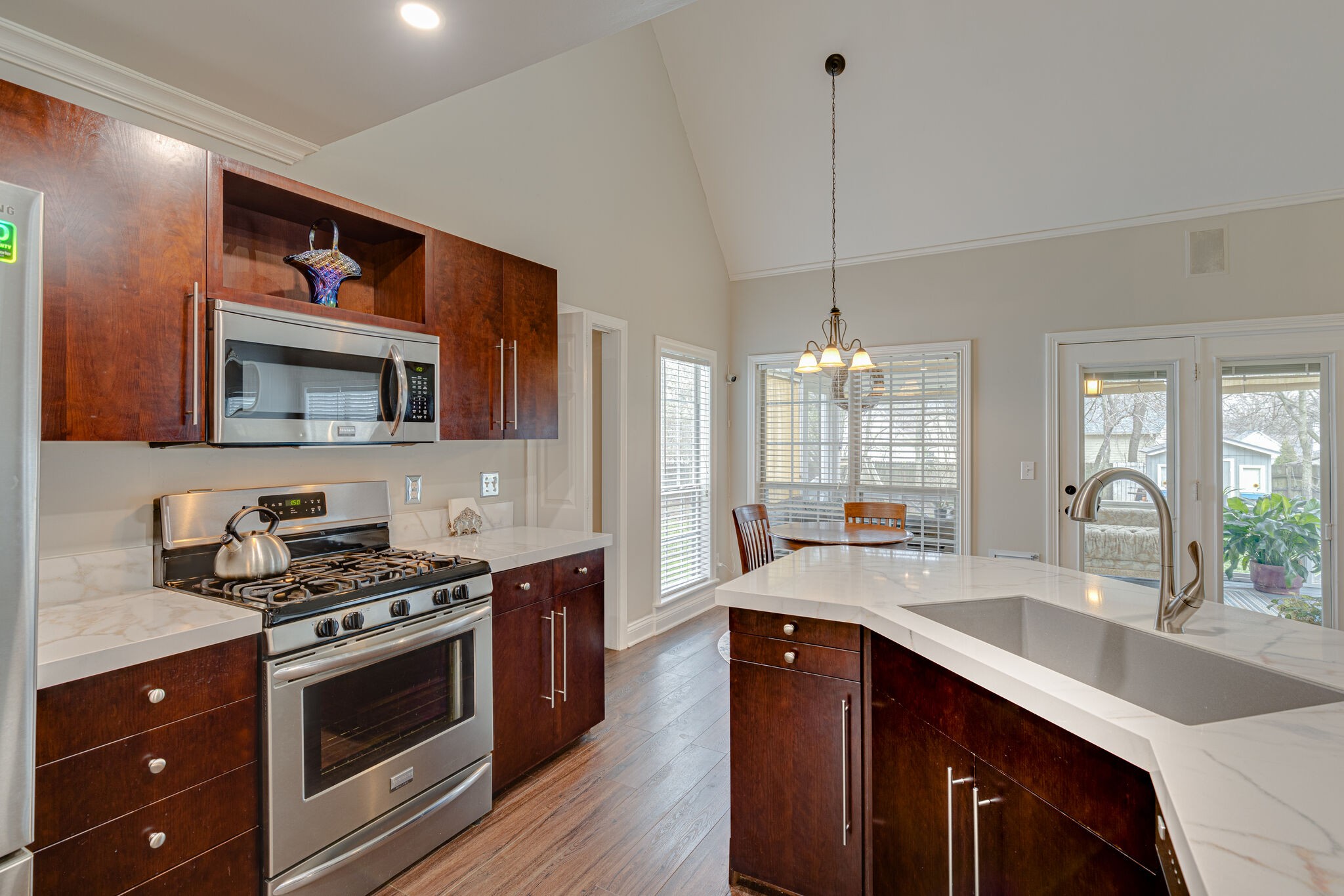 1906 Kent Lane Spring Hill, TN 37174 - Photo 15 of 39 a kitchen with stainless steel appliances granite countertop a sink stove and cabinets