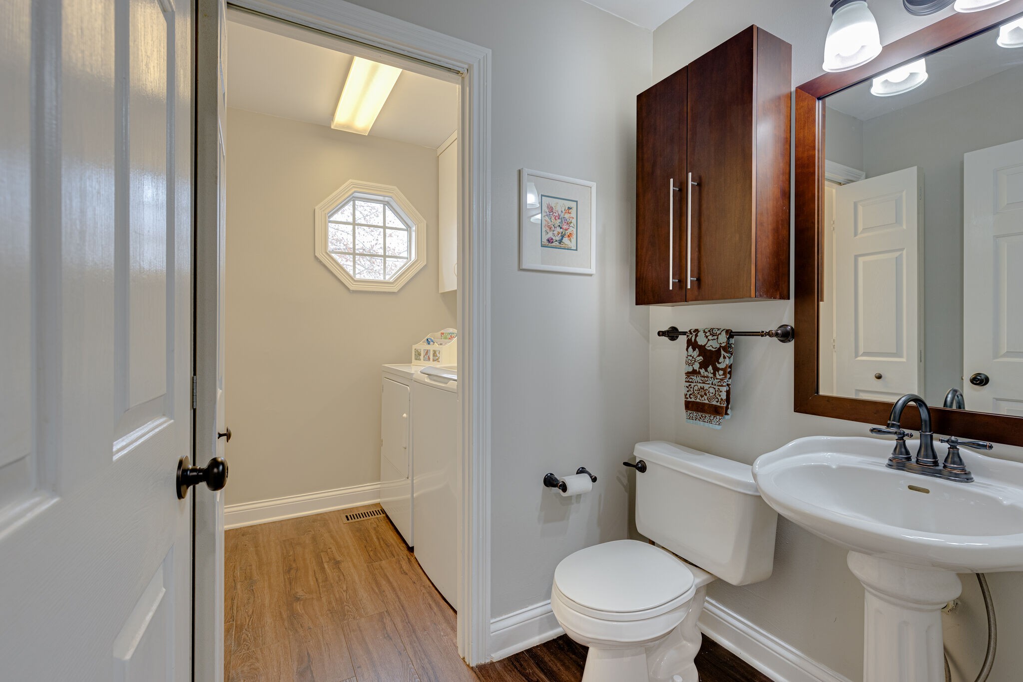 1906 Kent Lane Spring Hill, TN 37174 - Photo 23 of 39 a bathroom with a toilet a sink and mirror