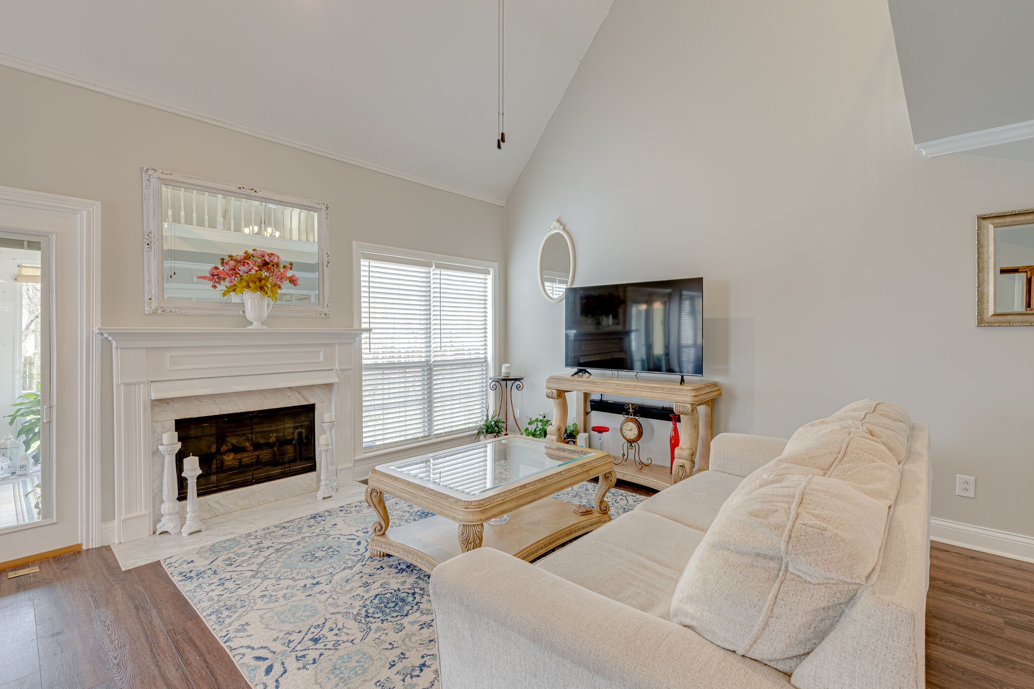 1906 Kent Lane Spring Hill, TN 37174 - Photo 9 of 39 a living room with furniture a fireplace and a flat screen tv