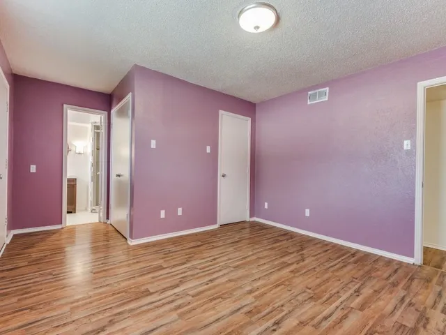 a view of a livingroom with wooden floor