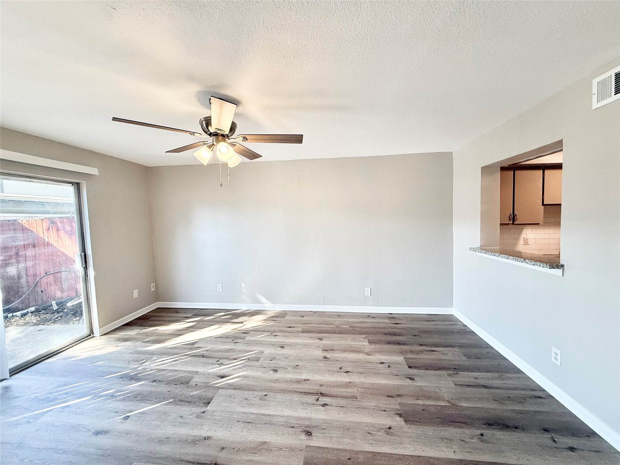 7980 Grove Ridge Drive Houston, TX 77061 - Photo 8 of 19 Nice, big Living/Dining area with easy to care for flooring and sliding doors to Patio