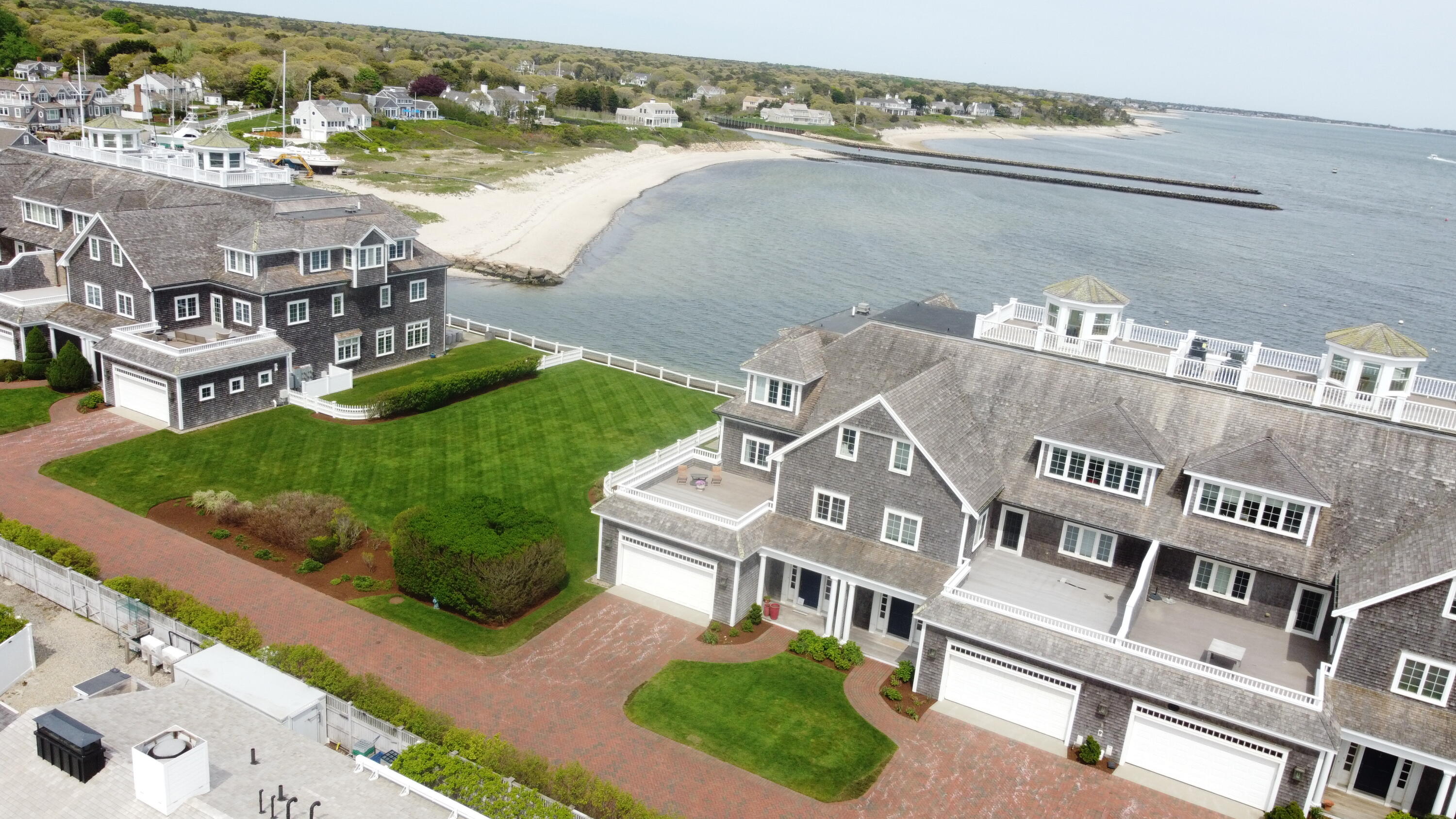 23 Snow Inn Road, Unit 7 Harwich Port, MA 02646 - Photo 5 of 37 a view of a lake with a building in the background