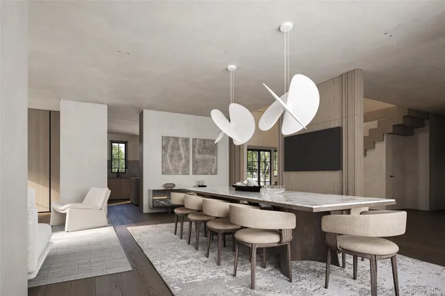 a living room with a couch dining table a table and chairs