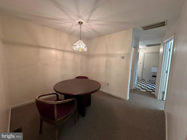 an empty room with a empty space and windows