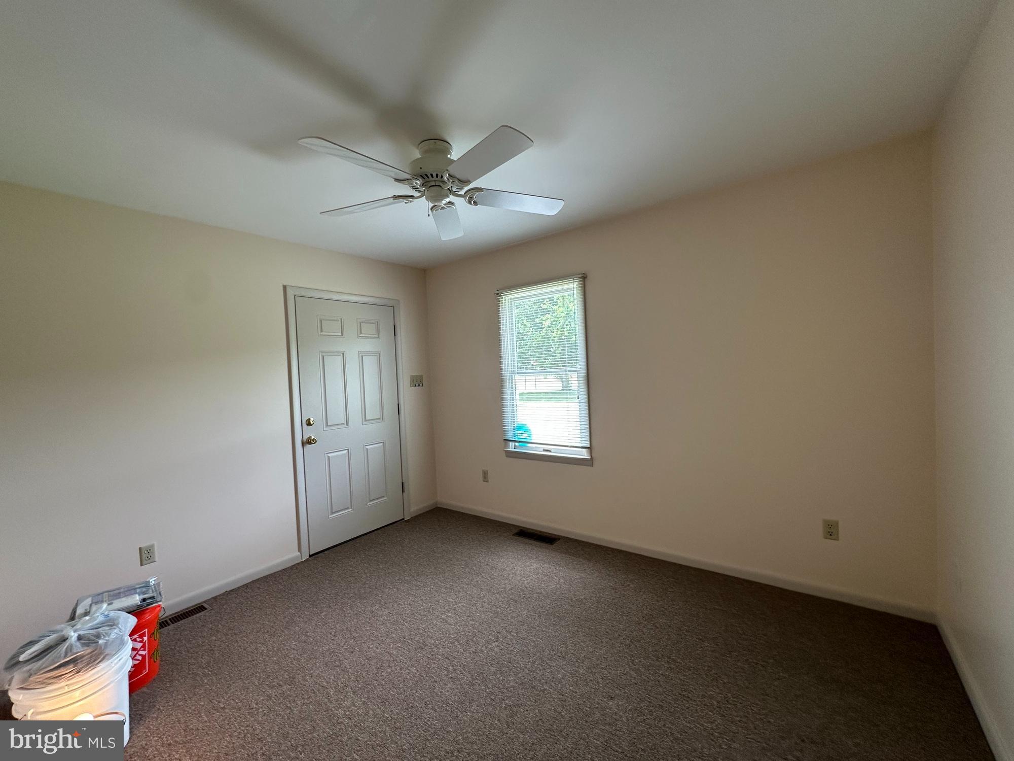 3 Delaware Avenue Delmar, DE 19940 - Photo 5 of 10 an empty room with a empty space and windows