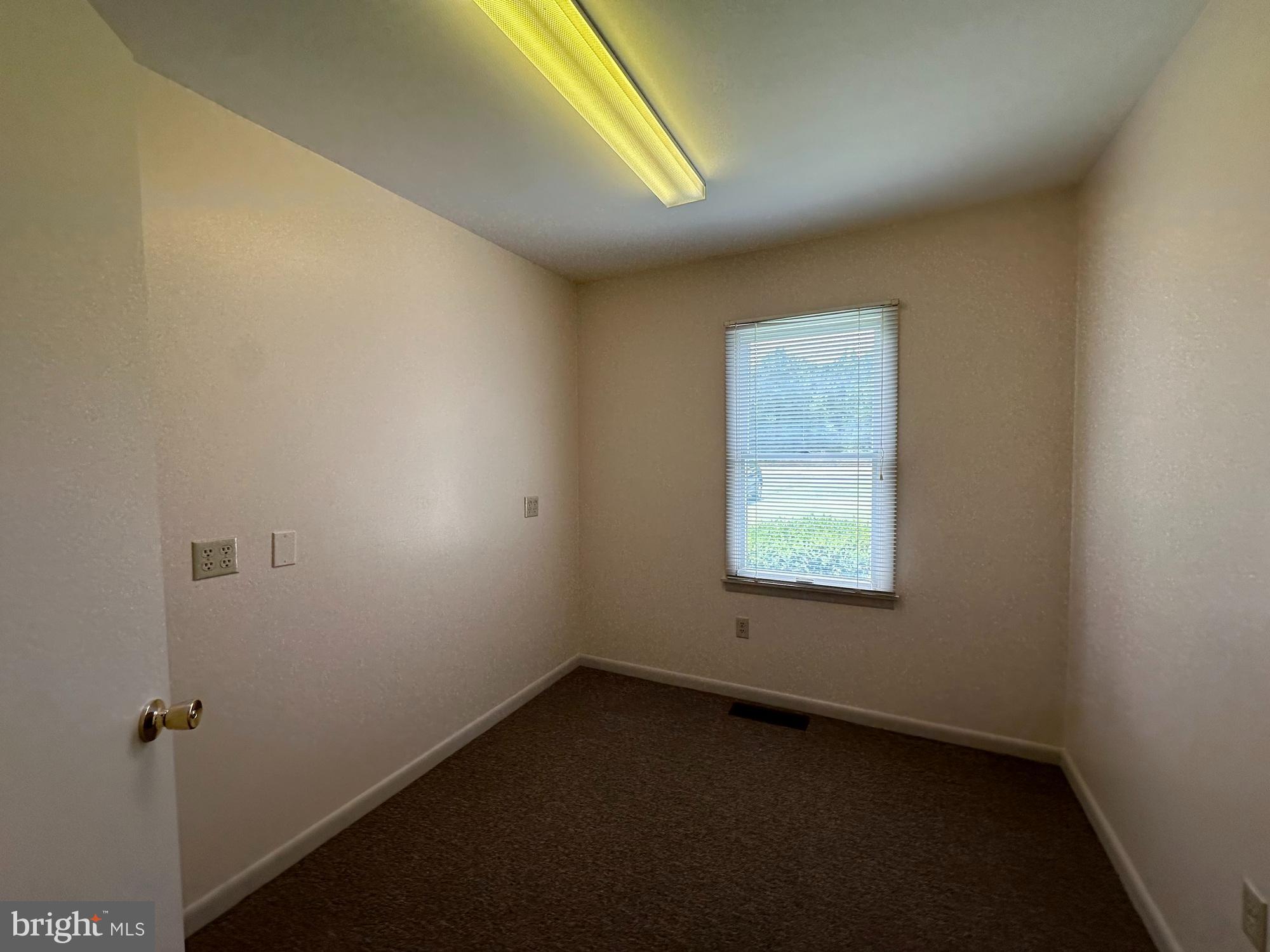 3 Delaware Avenue Delmar, DE 19940 - Photo 6 of 10 an empty room with a window
