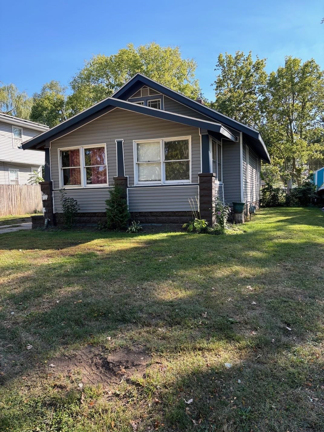 409 Barnum Road Rockford, IL 61109 - Photo 1 of 15 a view of a house with a yard