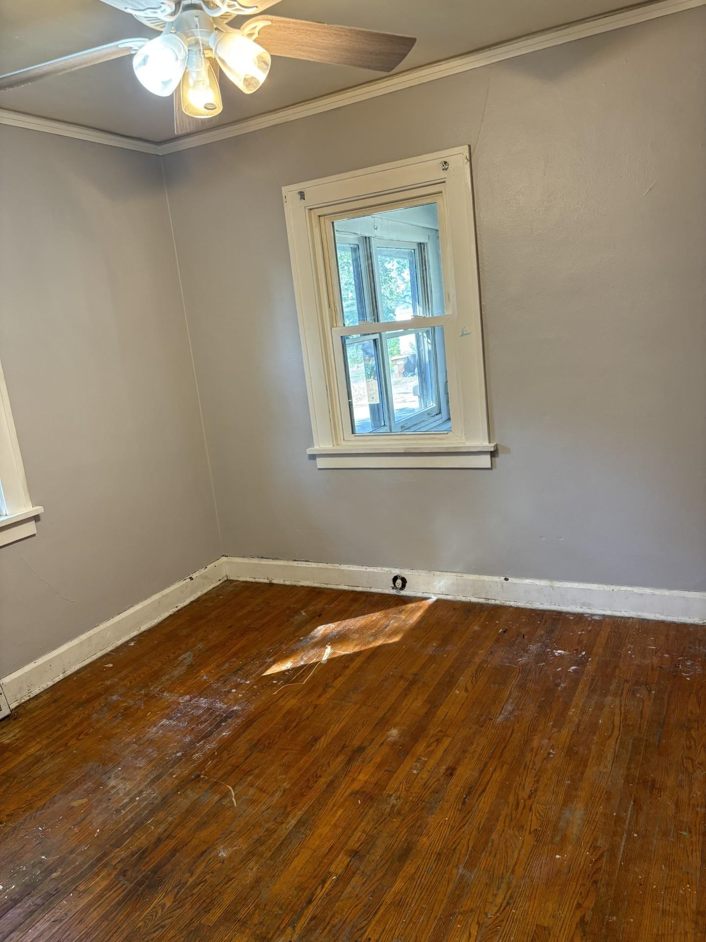 409 Barnum Road Rockford, IL 61109 - Photo 7 of 15 a view of a room with wooden floor and fan