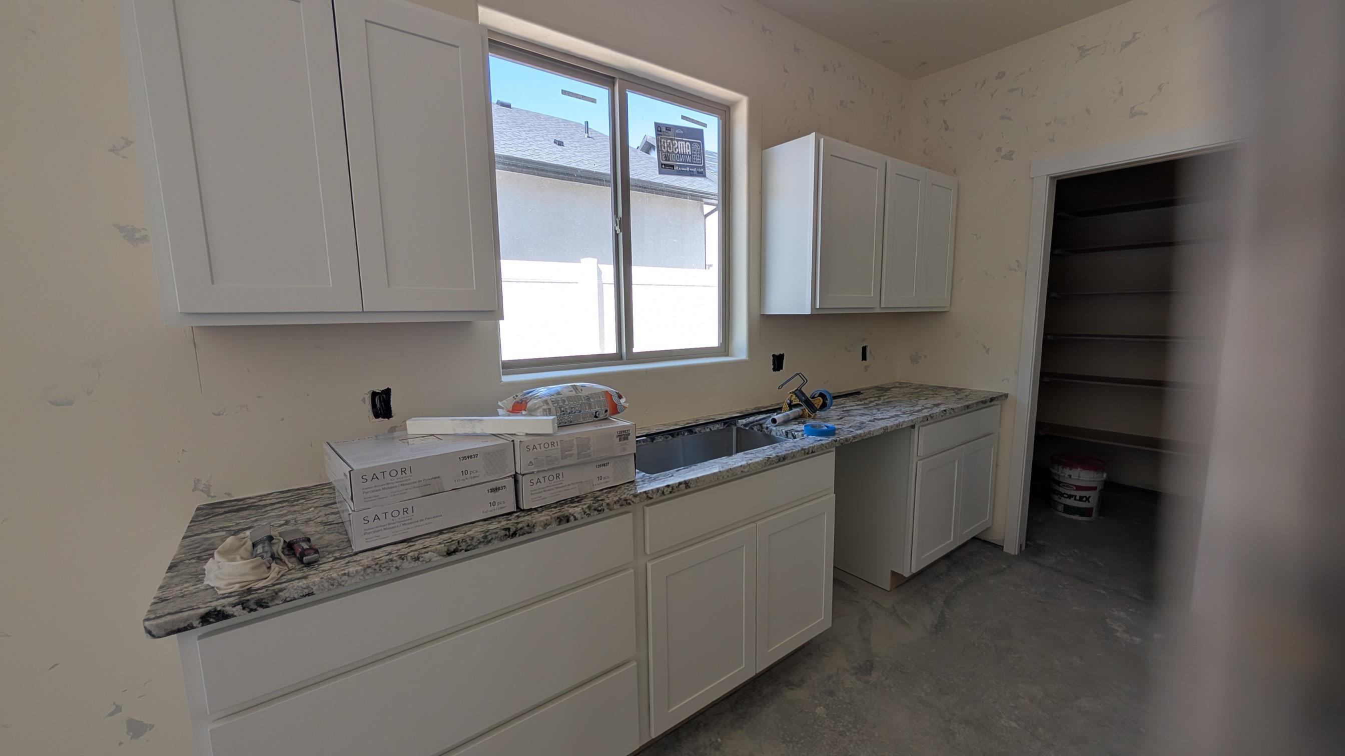2456 Hamilton Road, Unit A Grand Junction, CO 81505 - Photo 3 of 13 a kitchen with sink cabinets and window
