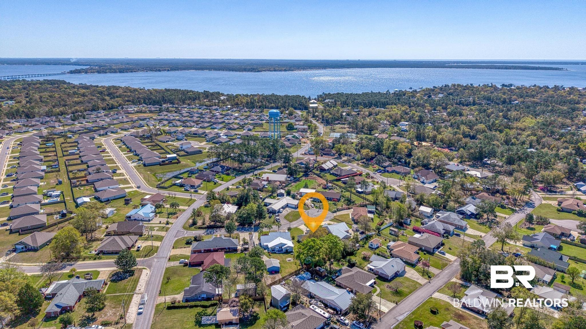 2881 Eslava Circle Lillian, AL 36549 - Photo 36 of 58 Aerial overview of property's location with a nearby body of water and nearby suburban area