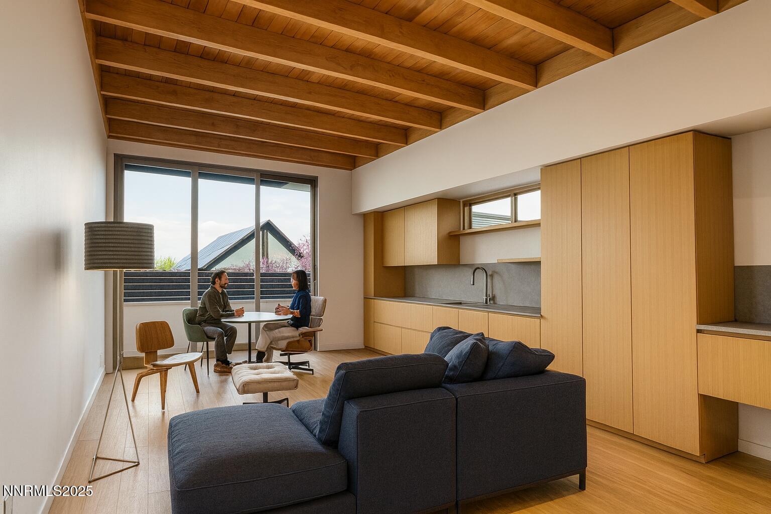 453 Cheney Street Reno, NV 89502 - Photo 3 of 17 a living room with furniture a flat screen tv and a table