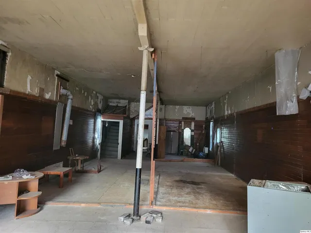 a view of a hallway with seating area