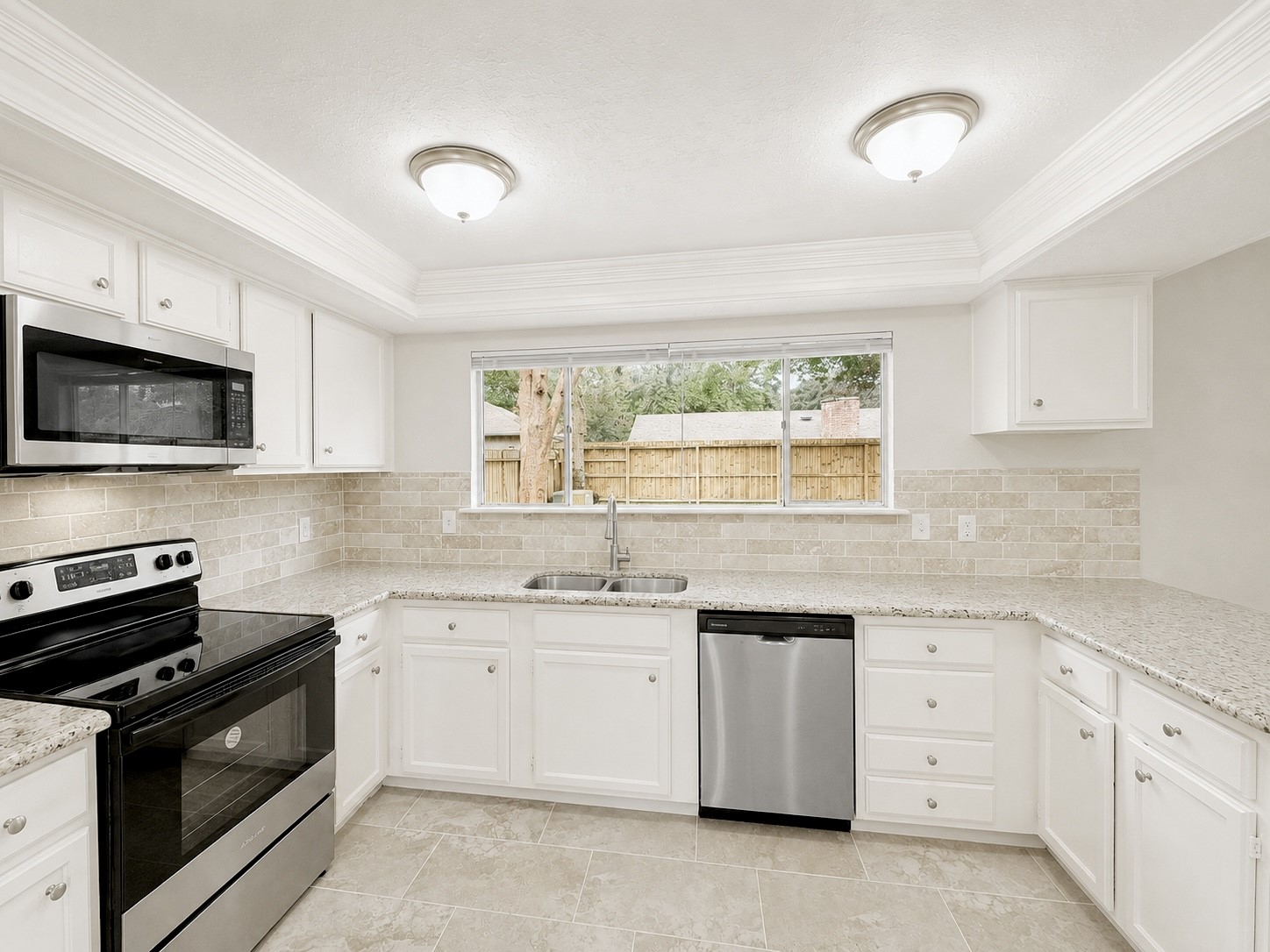 8407 Riverside Walk Lane Houston, TX 77064 - Photo 7 of 33 Bright and functional kitchen with abundant cabinetry, generous counter space, granite countertops, and modern finishes throughout.