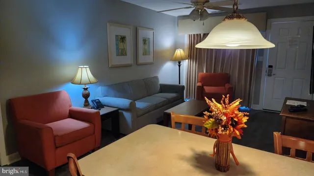 a bedroom with a bed and a lamp