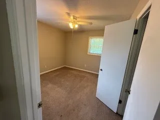 a bathroom with a toilet a sink and a mirror