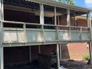 a view of a tree in front of a yard