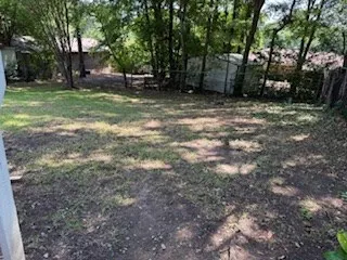 a view of a balcony with wooden floor