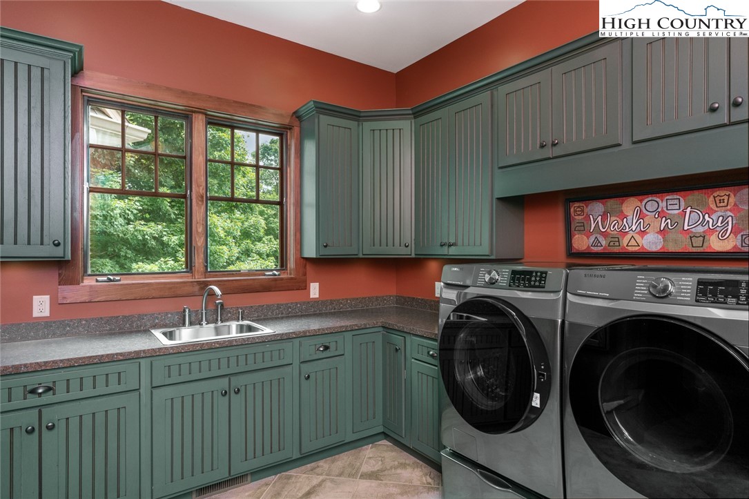 879 Winding Ridge Drive West Jefferson, NC 28694 - Photo 13 of 37 a utility room with sink dryer and washer