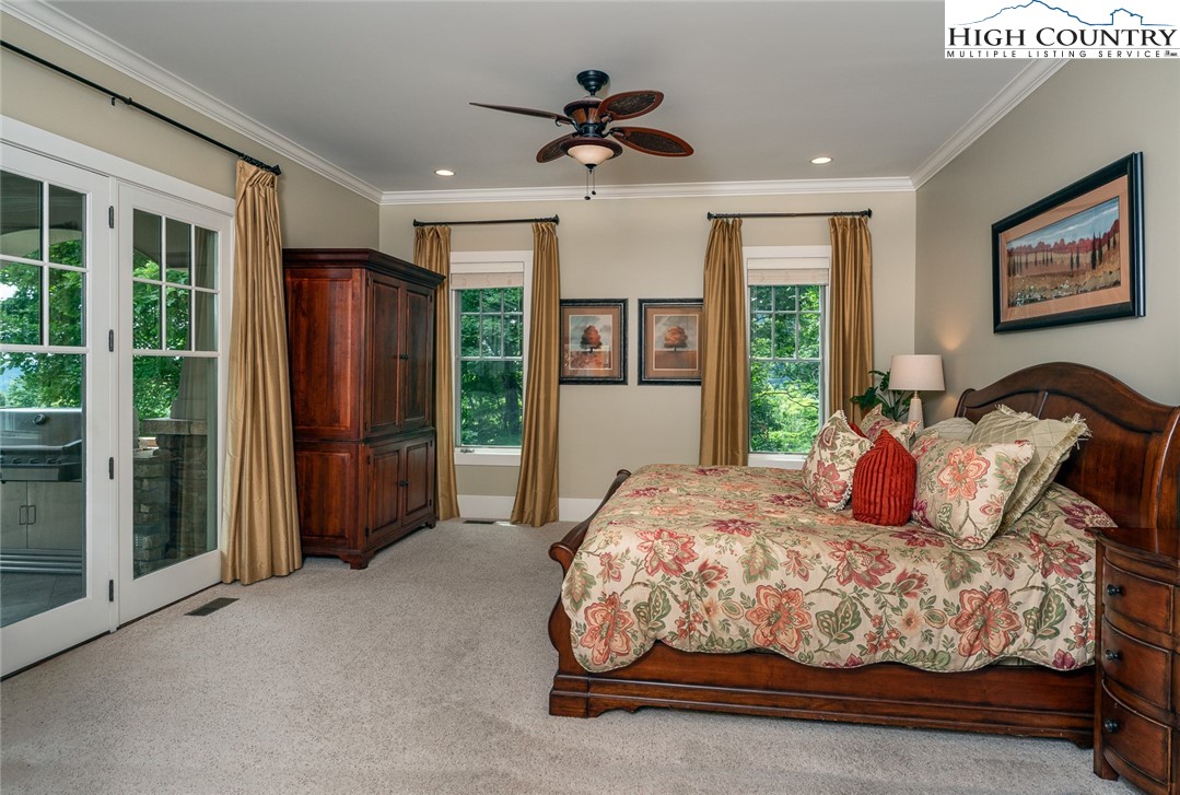 879 Winding Ridge Drive West Jefferson, NC 28694 - Photo 17 of 37 a bedroom with bed and large window
