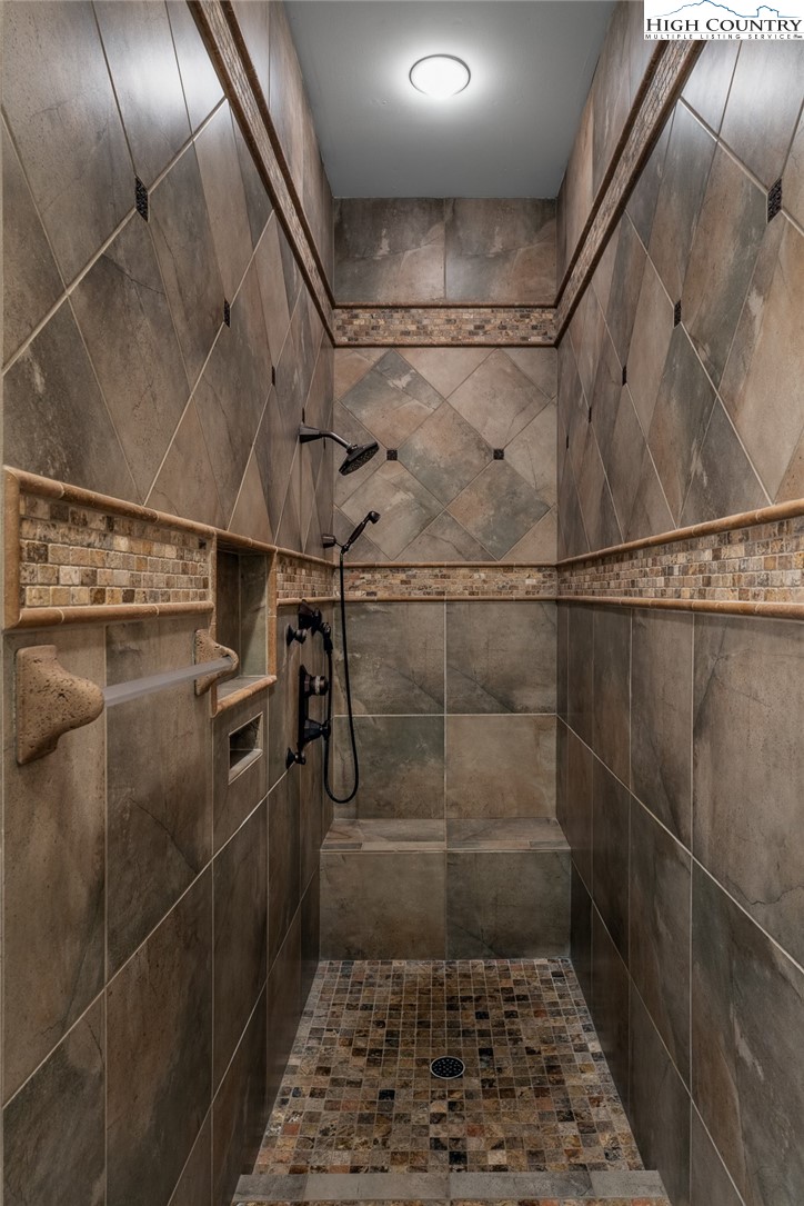 879 Winding Ridge Drive West Jefferson, NC 28694 - Photo 20 of 37 a bathroom with a shower