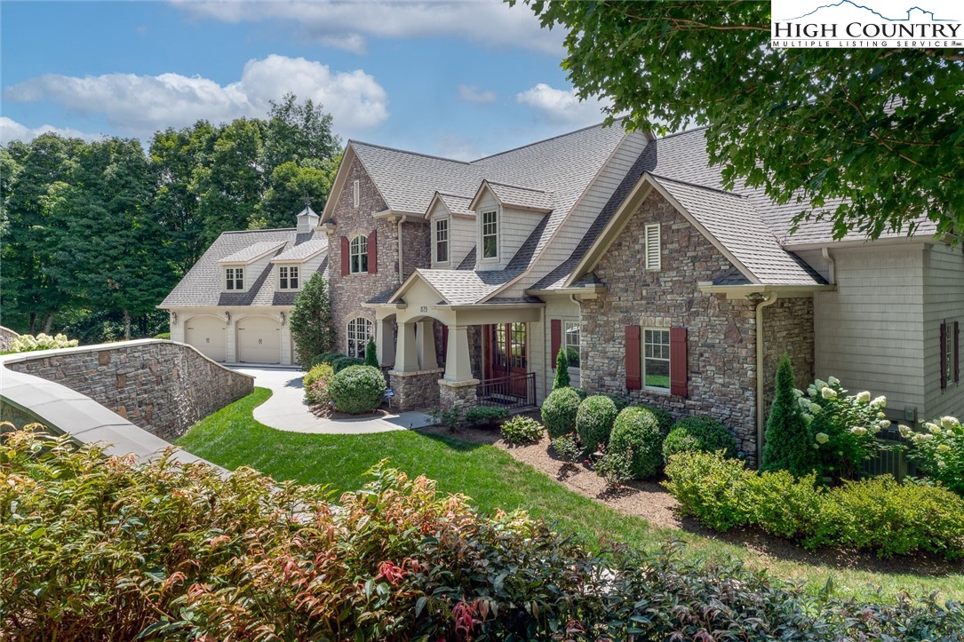 879 Winding Ridge Drive West Jefferson, NC 28694 - Photo 2 of 37 a front view of house with yard and green space