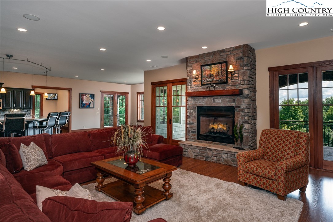 879 Winding Ridge Drive West Jefferson, NC 28694 - Photo 30 of 37 a living room with furniture and a fireplace