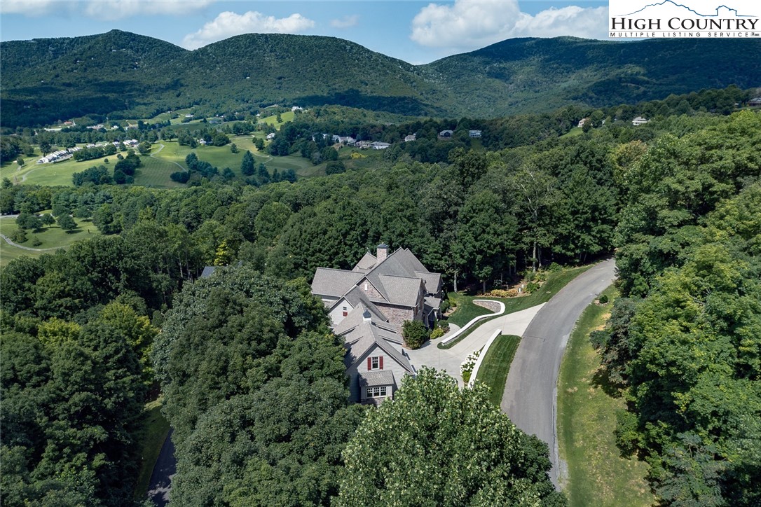 879 Winding Ridge Drive West Jefferson, NC 28694 - Photo 36 of 37 an aerial view of a house with outdoor space and garden