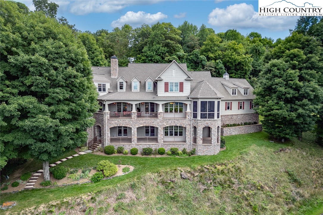 879 Winding Ridge Drive West Jefferson, NC 28694 - Photo 4 of 37 front view of a house with a yard