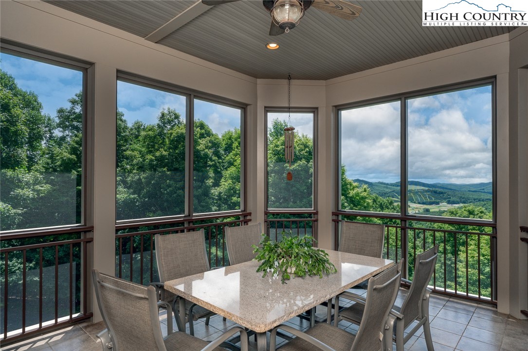 879 Winding Ridge Drive West Jefferson, NC 28694 - Photo 5 of 37 a view of a dining room with furniture window and outside view