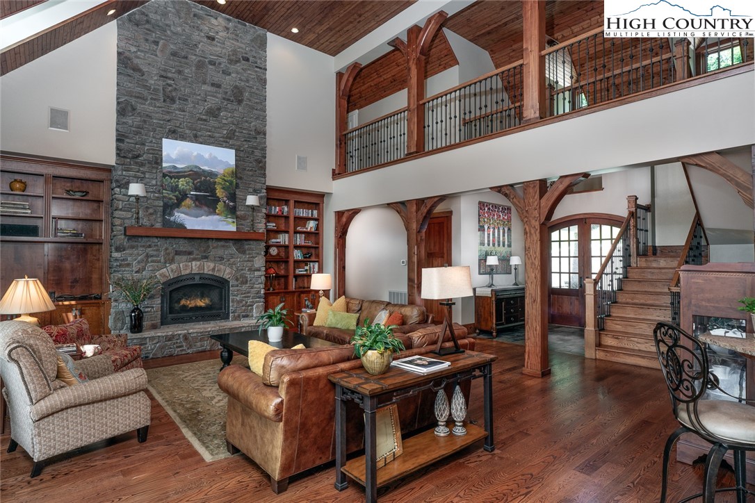 879 Winding Ridge Drive West Jefferson, NC 28694 - Photo 9 of 37 a living room with furniture and a fireplace