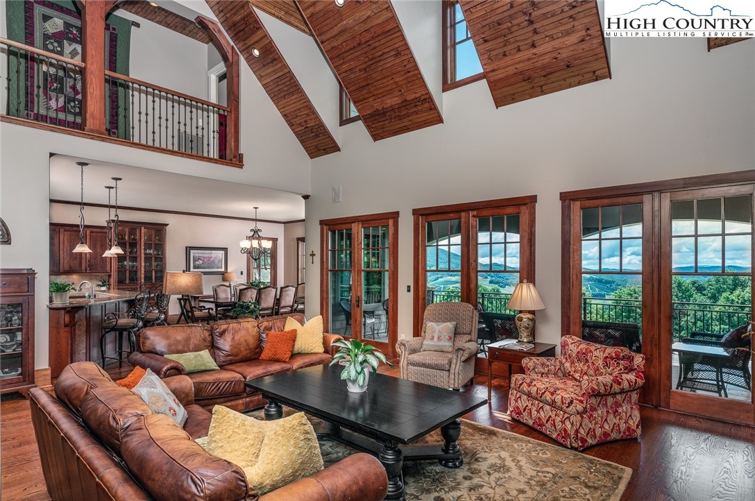 879 Winding Ridge Drive West Jefferson, NC 28694 - Photo 10 of 37 a living room with furniture and a large window