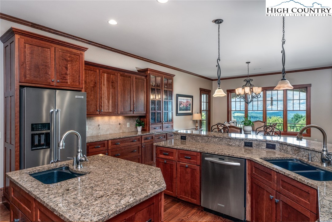 879 Winding Ridge Drive West Jefferson, NC 28694 - Photo 10 of 37 a kitchen with sink a counter space appliances and cabinets