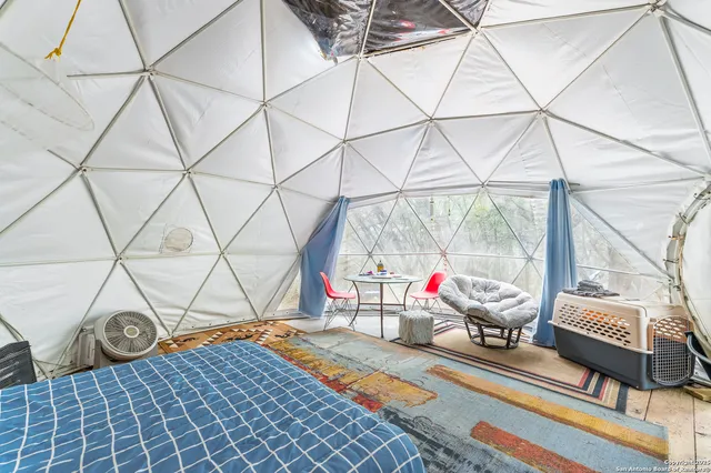a view of a chairs and table in the patio