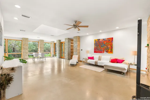 a living room with furniture and flat screen tv