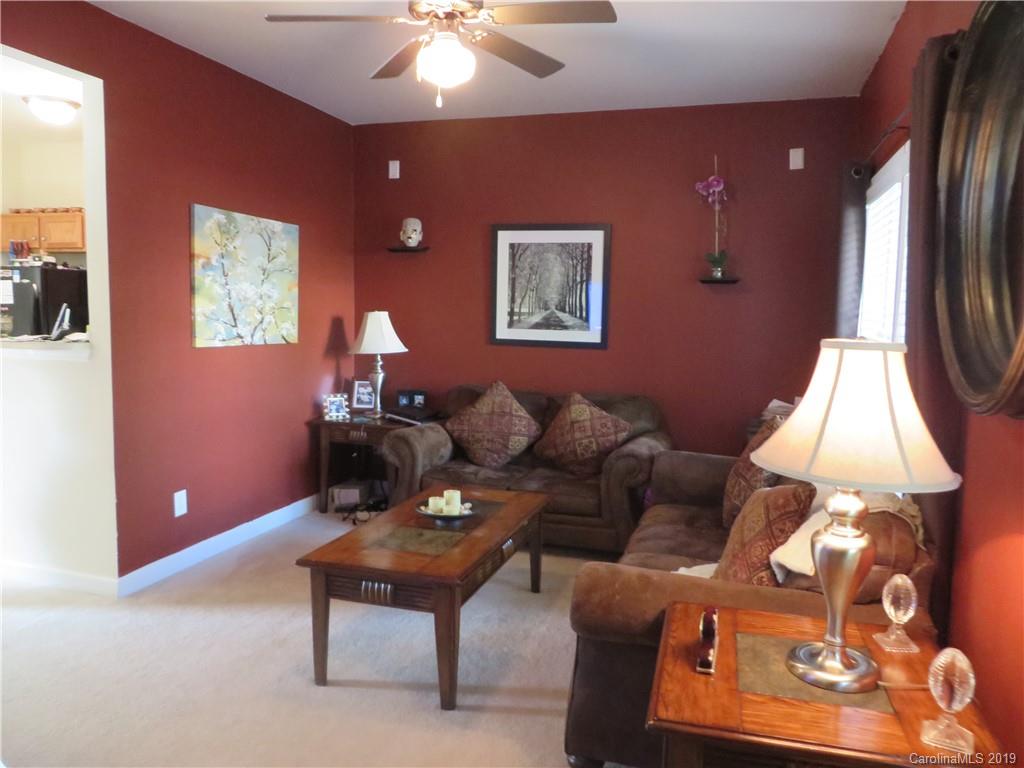 12315 Cross Meadow Road Huntersville, NC 28078 - Photo 3 of 12 a living room with furniture and a chandelier