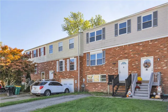a front view of a building with garden