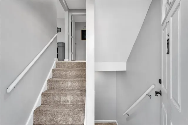 a view of staircase with white walls and white walls