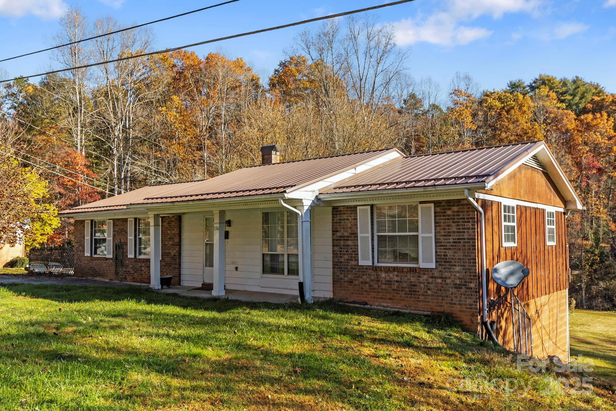 150 Trent Road Brevard, NC 28712 - Photo 2 of 22 a view of a house with back yard