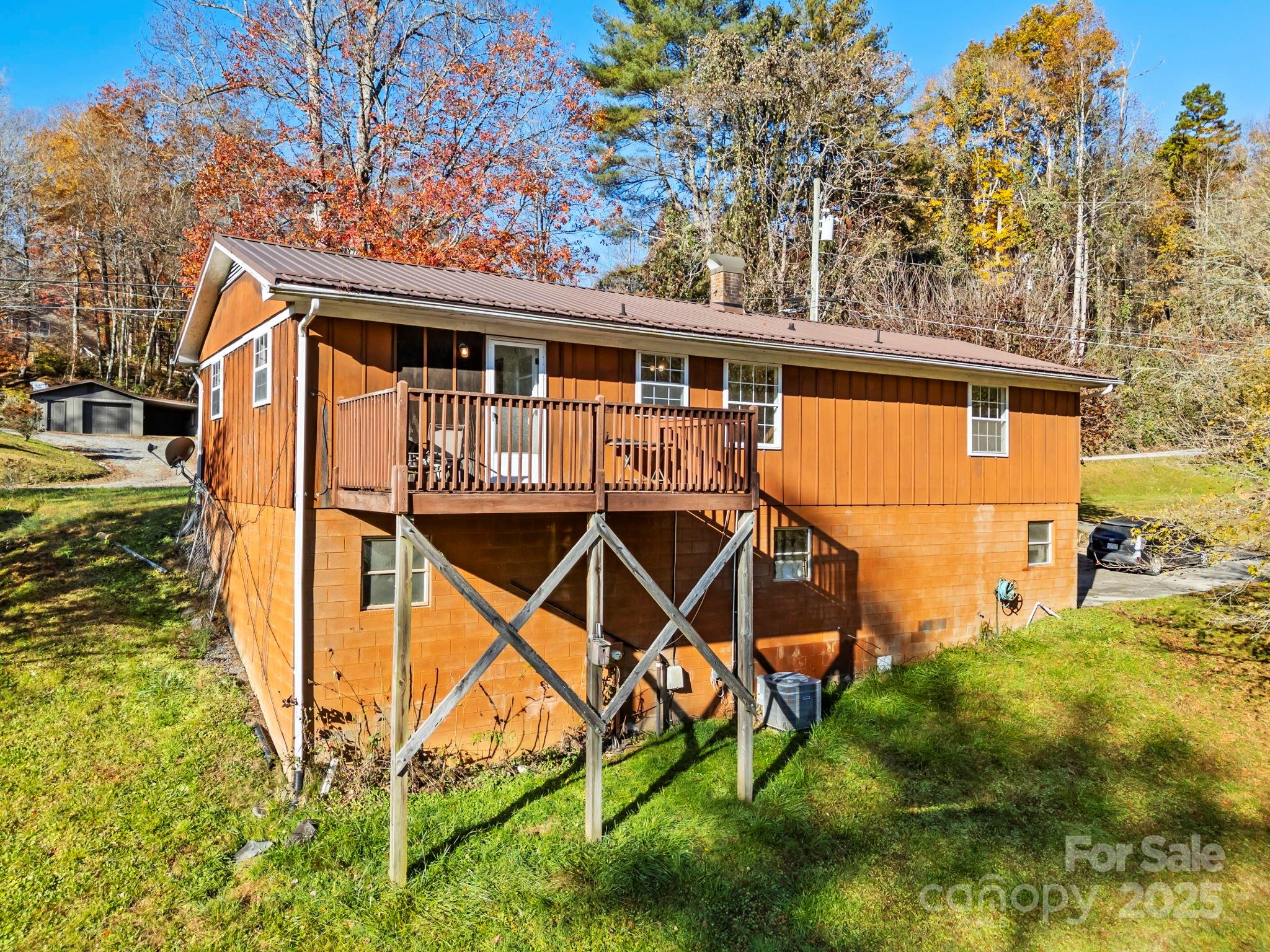 150 Trent Road Brevard, NC 28712 - Photo 4 of 22 a view of a house with backyard and sitting area