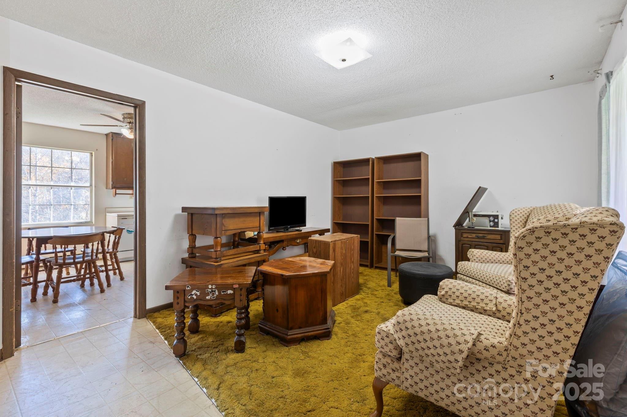 150 Trent Road Brevard, NC 28712 - Photo 6 of 22 a view of a livingroom with workspace and a couch